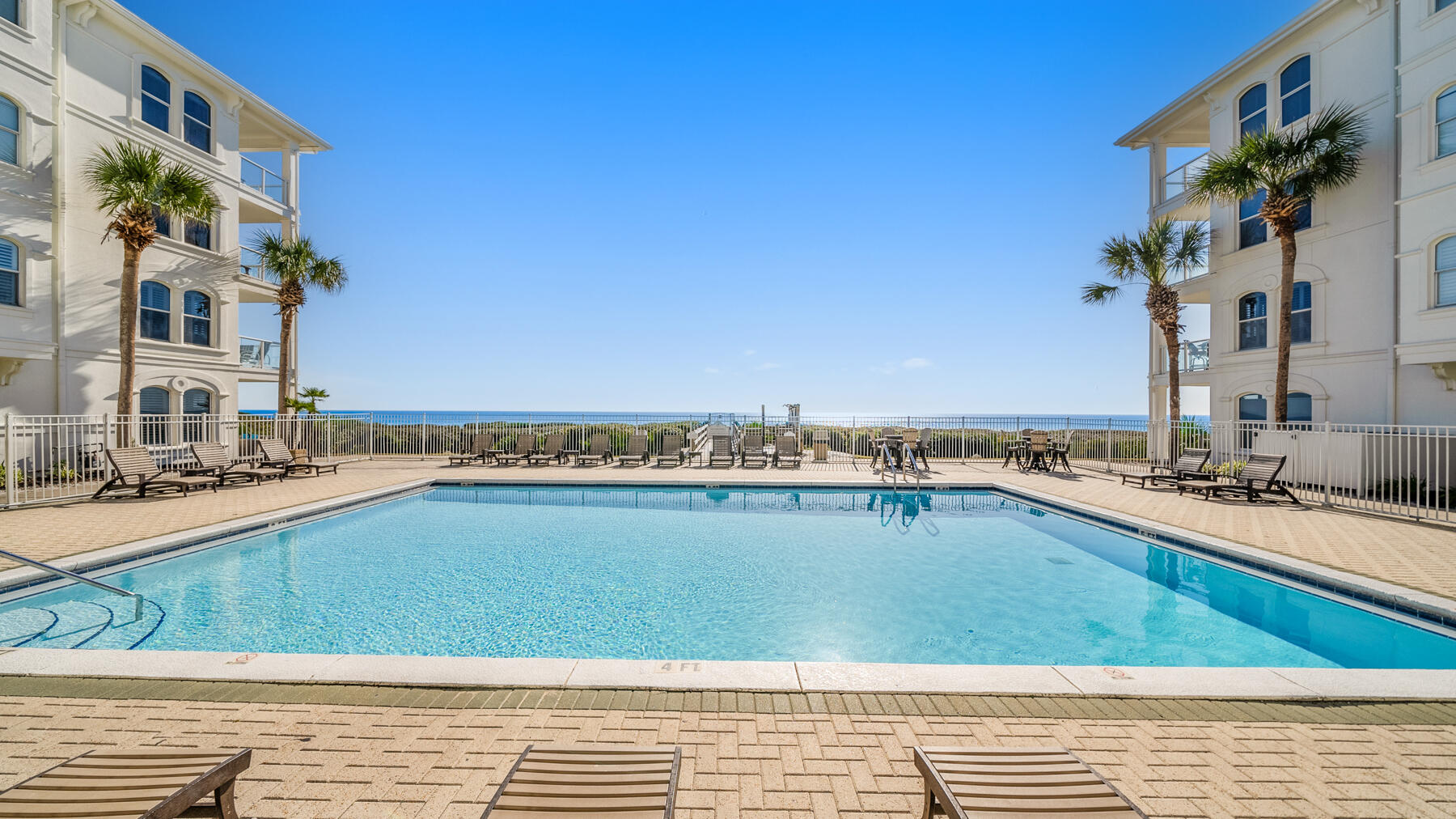 10140 East County Highway 30A, Unit 2 Inlet Beach, FL 32461 - Photo 6 of 92 a view of a swimming pool with an outdoor seating