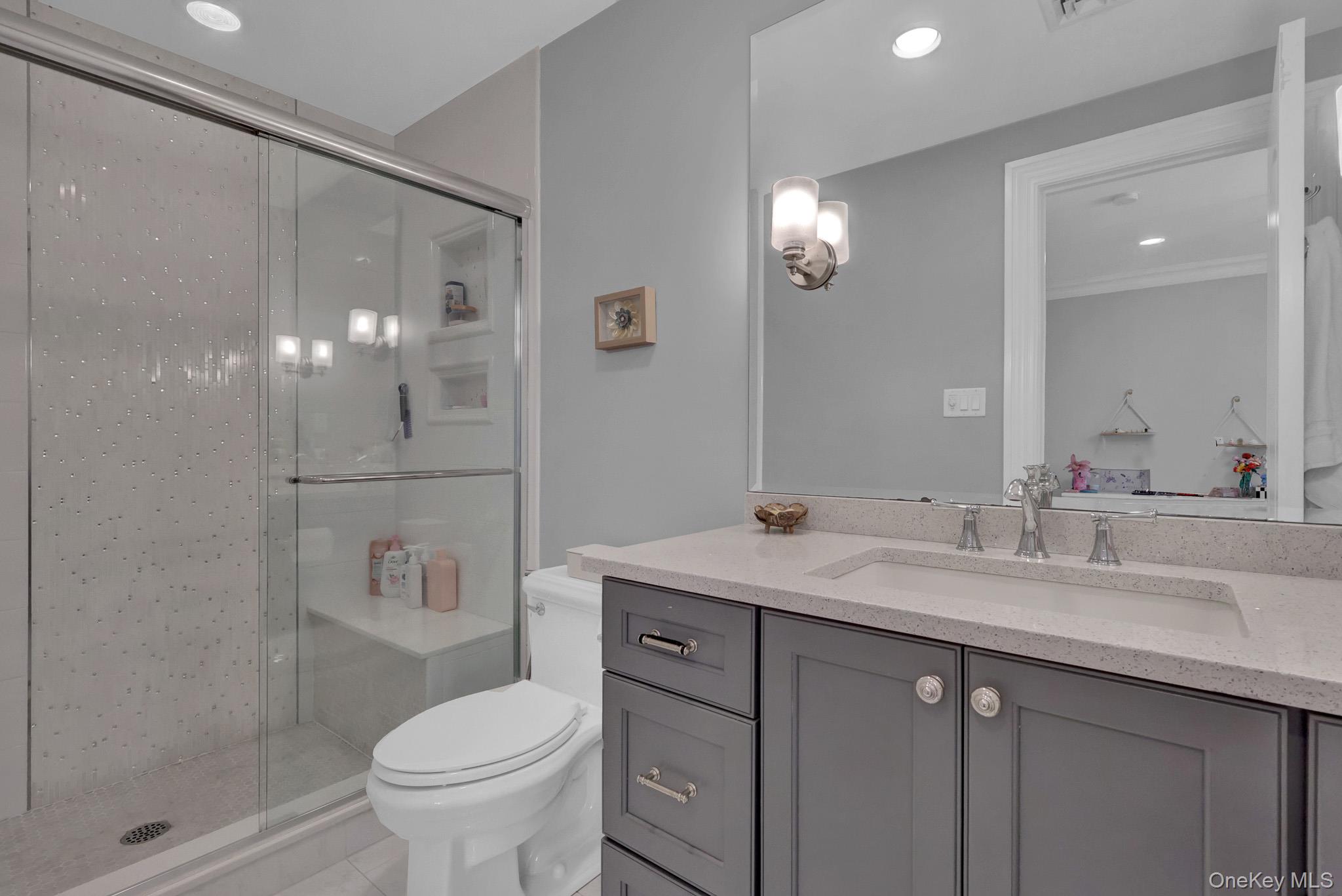 36 Old Field Road Setauket, NY 11733 - Photo 41 of 42 a bathroom with a sink a toilet and shower