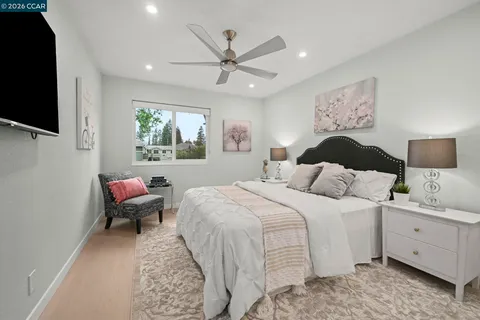 a bedroom with a bed and a chair
