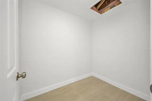 a bathroom with a toilet and a shower curtain