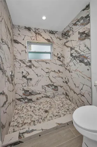 a bathroom with a toilet sink and bathtub