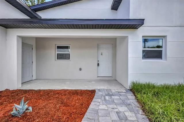 a kitchen with stainless steel appliances granite countertop a stove a sink dishwasher a microwave oven and a oven with wooden cabinets