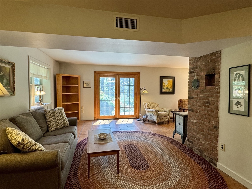 1450 W Road Ashfield, MA 01330 - Photo 12 of 36 a living room with furniture and a flat screen tv