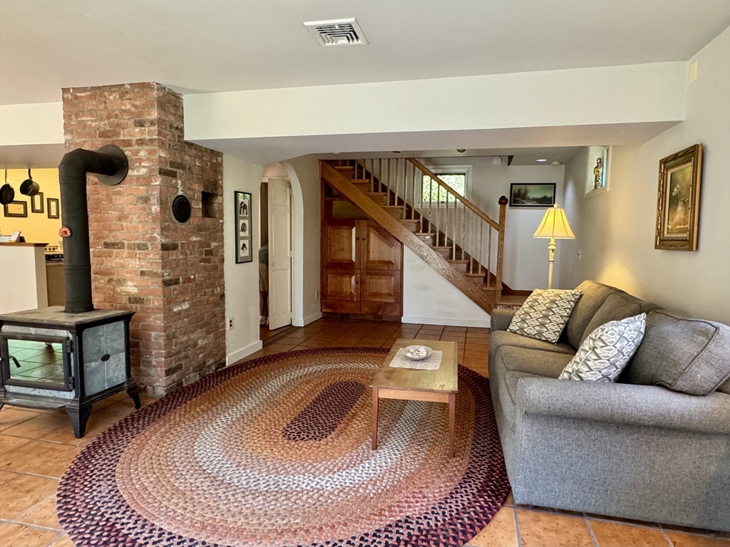 1450 W Road Ashfield, MA 01330 - Photo 14 of 36 a living room with furniture and a rug