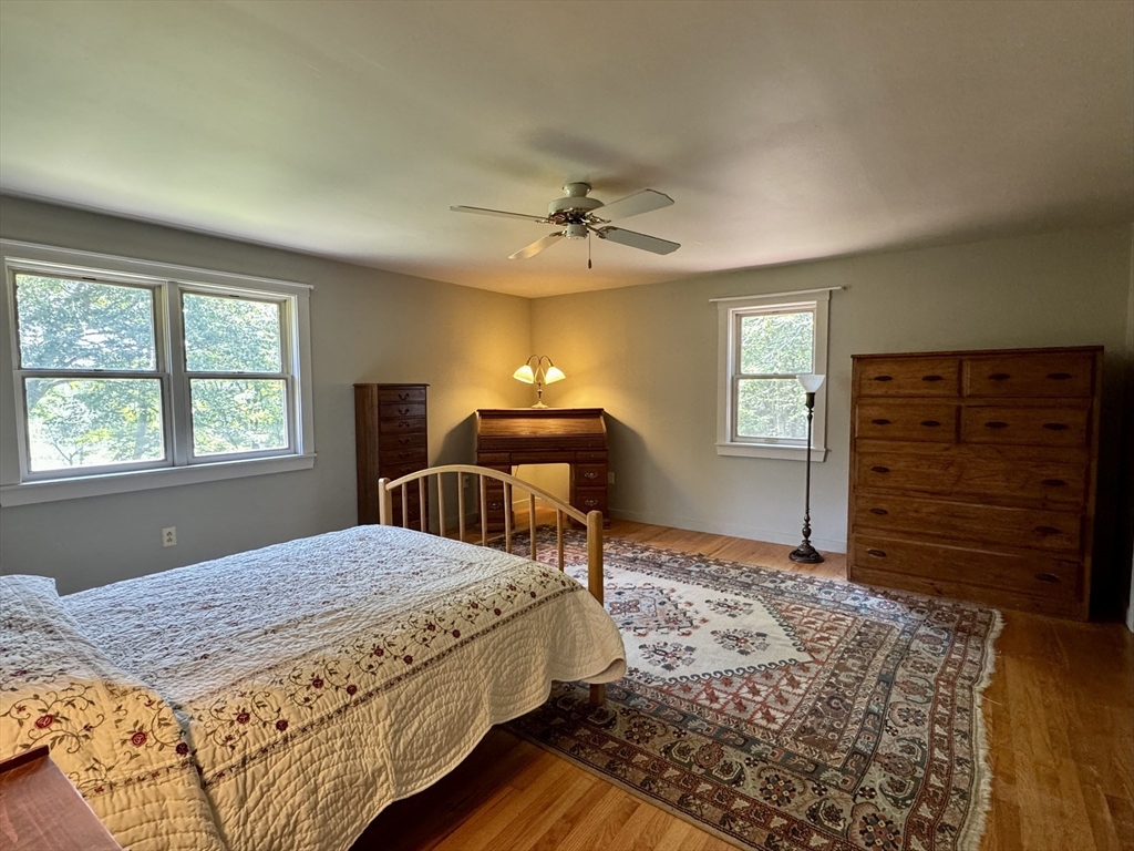 1450 W Road Ashfield, MA 01330 - Photo 15 of 36 a bedroom with a bed and a dresser
