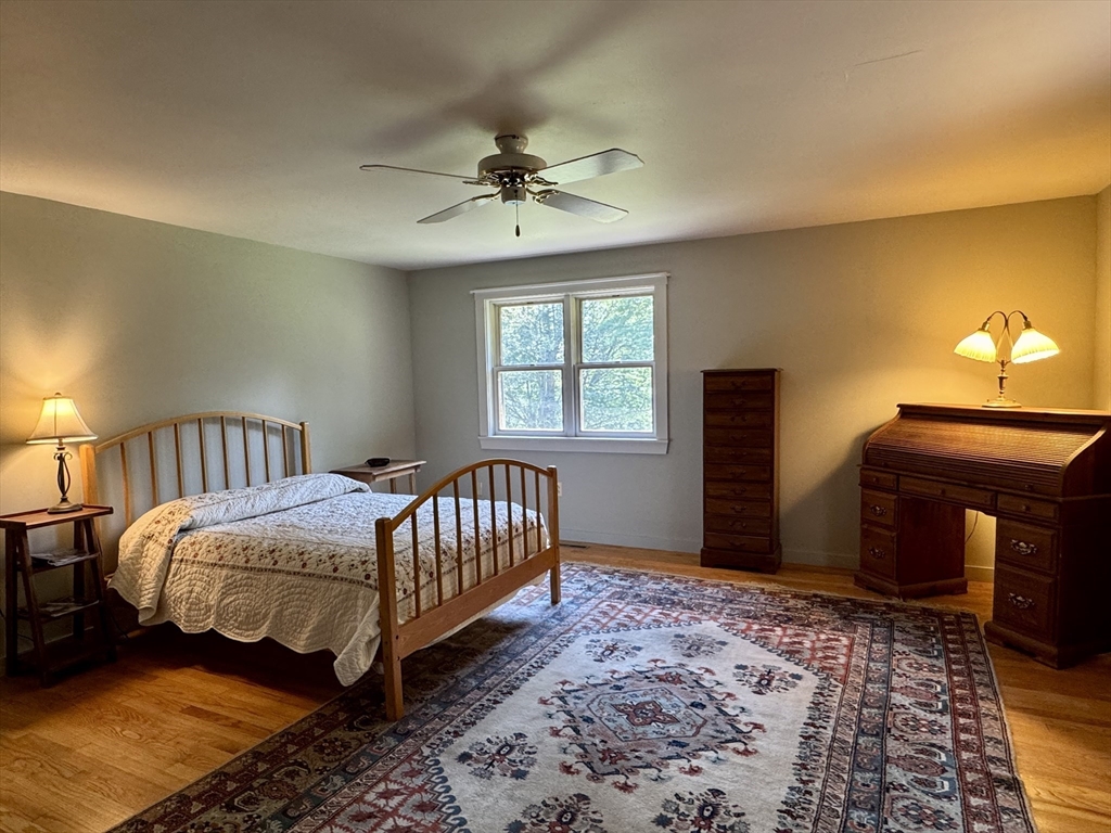 1450 W Road Ashfield, MA 01330 - Photo 16 of 36 a bedroom with a bed and a window