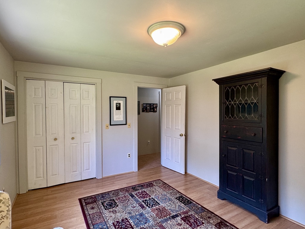 1450 W Road Ashfield, MA 01330 - Photo 20 of 36 a view of an empty room and wooden floor