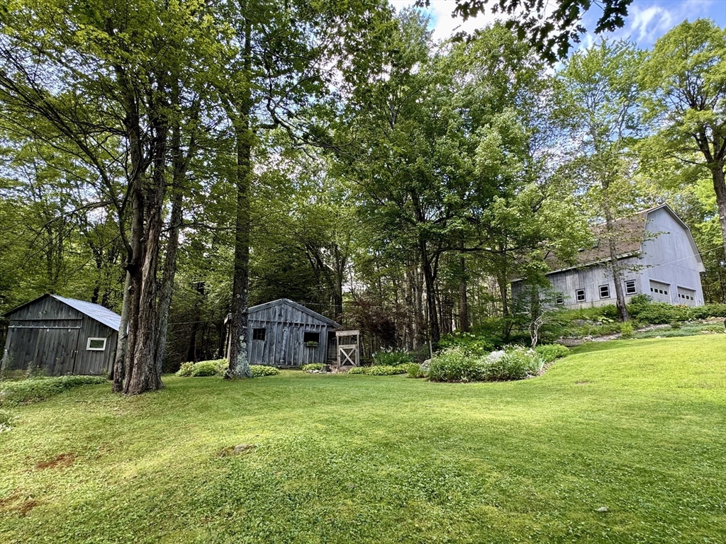 1450 W Road Ashfield, MA 01330 - Photo 2 of 36 a view of a house with backyard and garden
