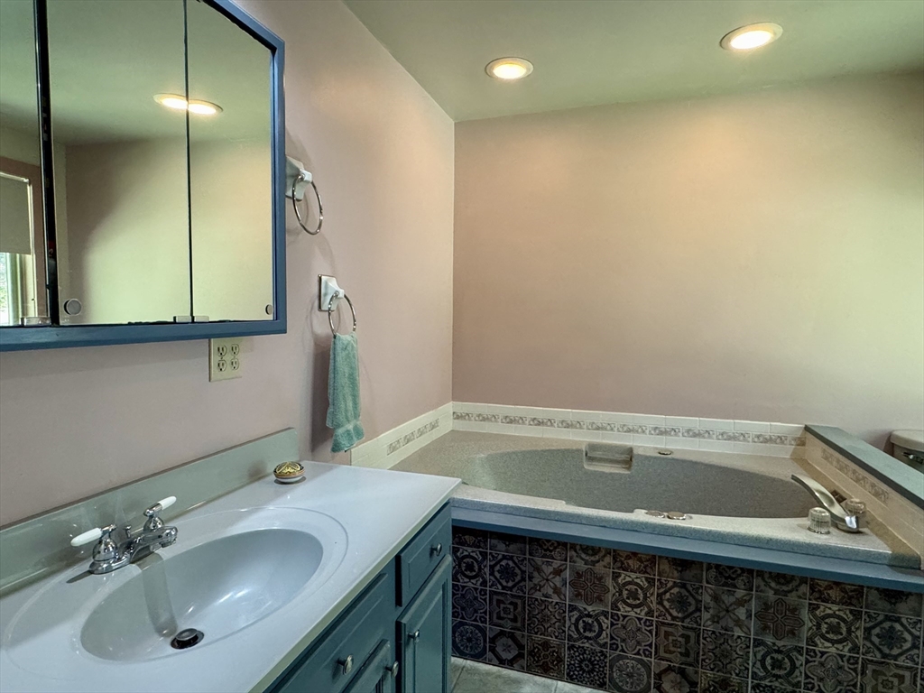 1450 W Road Ashfield, MA 01330 - Photo 23 of 36 a bathroom with a sink and a mirror