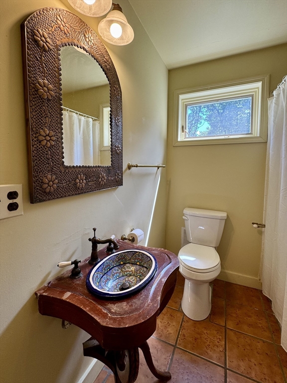 1450 W Road Ashfield, MA 01330 - Photo 25 of 36 a bathroom with a toilet a sink and mirror