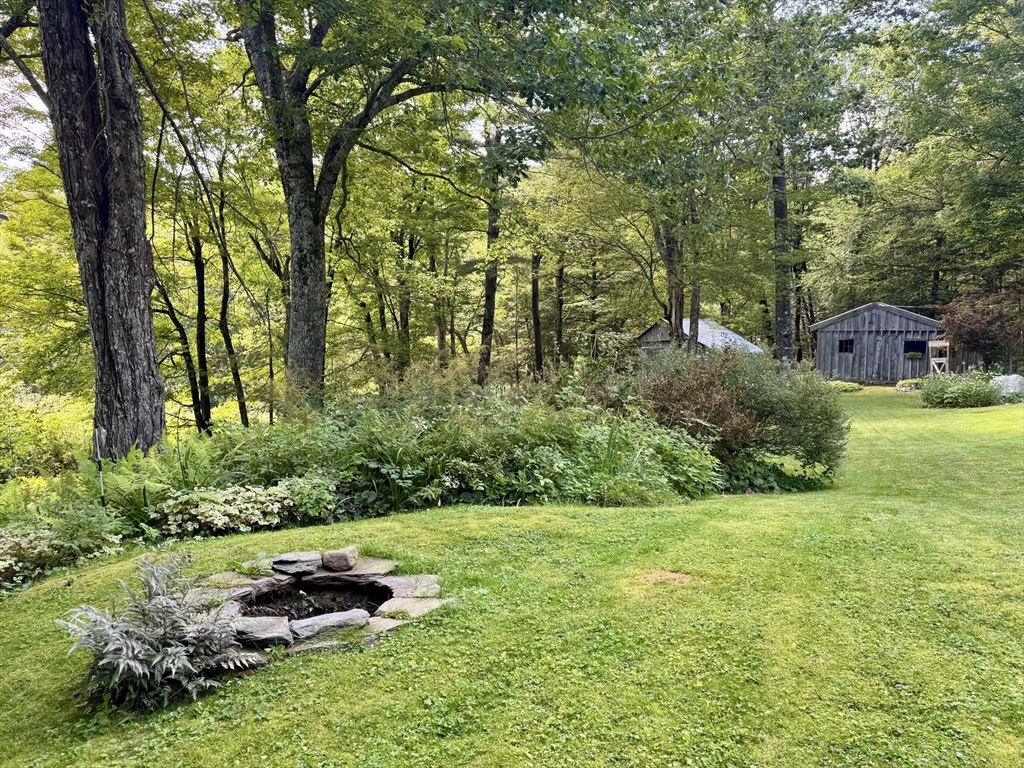 1450 W Road Ashfield, MA 01330 - Photo 3 of 36 a garden with trees in the background