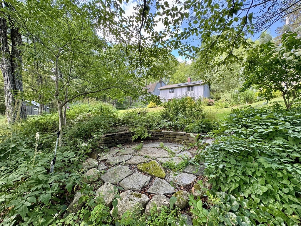 1450 W Road Ashfield, MA 01330 - Photo 35 of 36 a backyard of a house with lots of green space