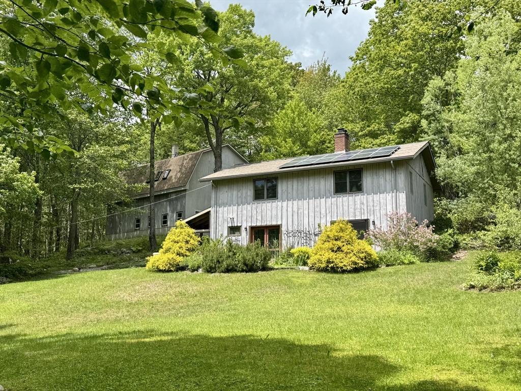 1450 W Road Ashfield, MA 01330 - Photo 36 of 36 a front view of a house with garden