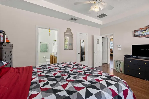 a bathroom with a sink vanity mirror and toilet