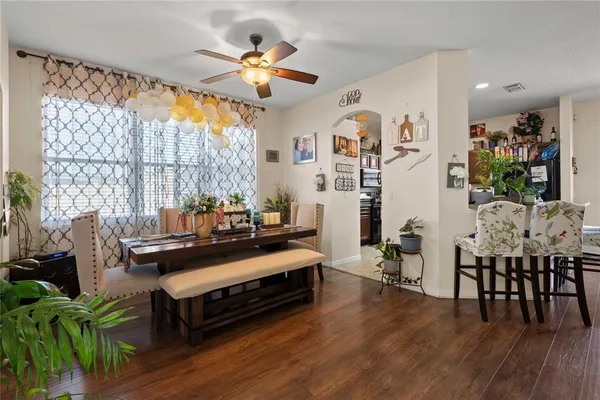 a view of a dining room with furniture window and outside view