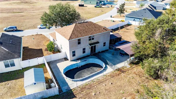 aerial view of a house with outdoor space