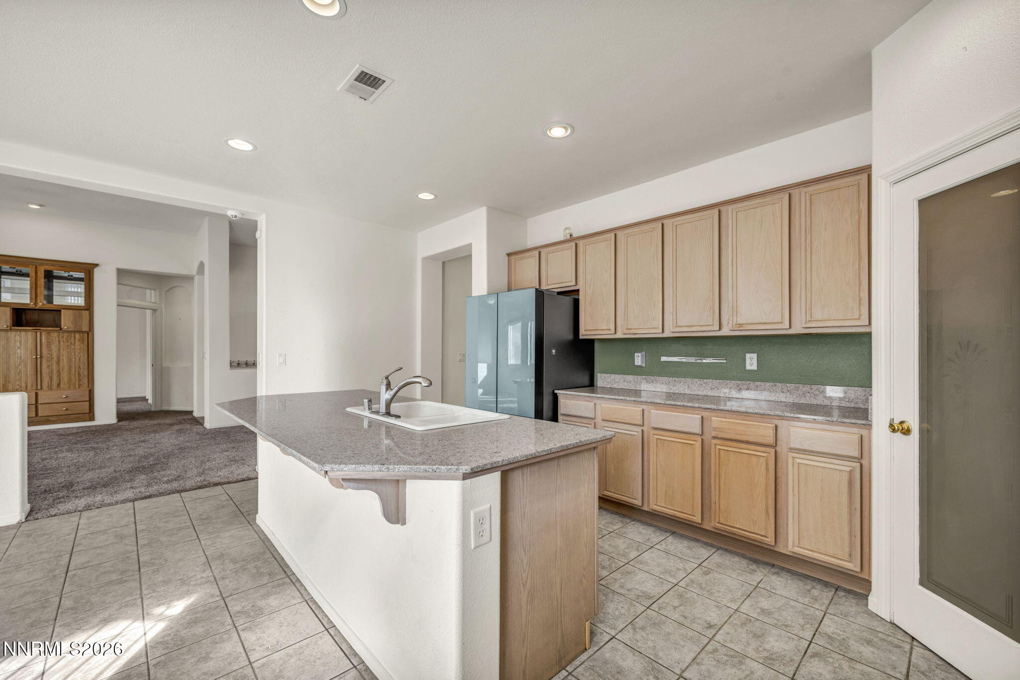 1472 Gaucho Lane Reno, NV 89521 - Photo 18 of 38 a kitchen with stainless steel appliances granite countertop a sink and cabinets