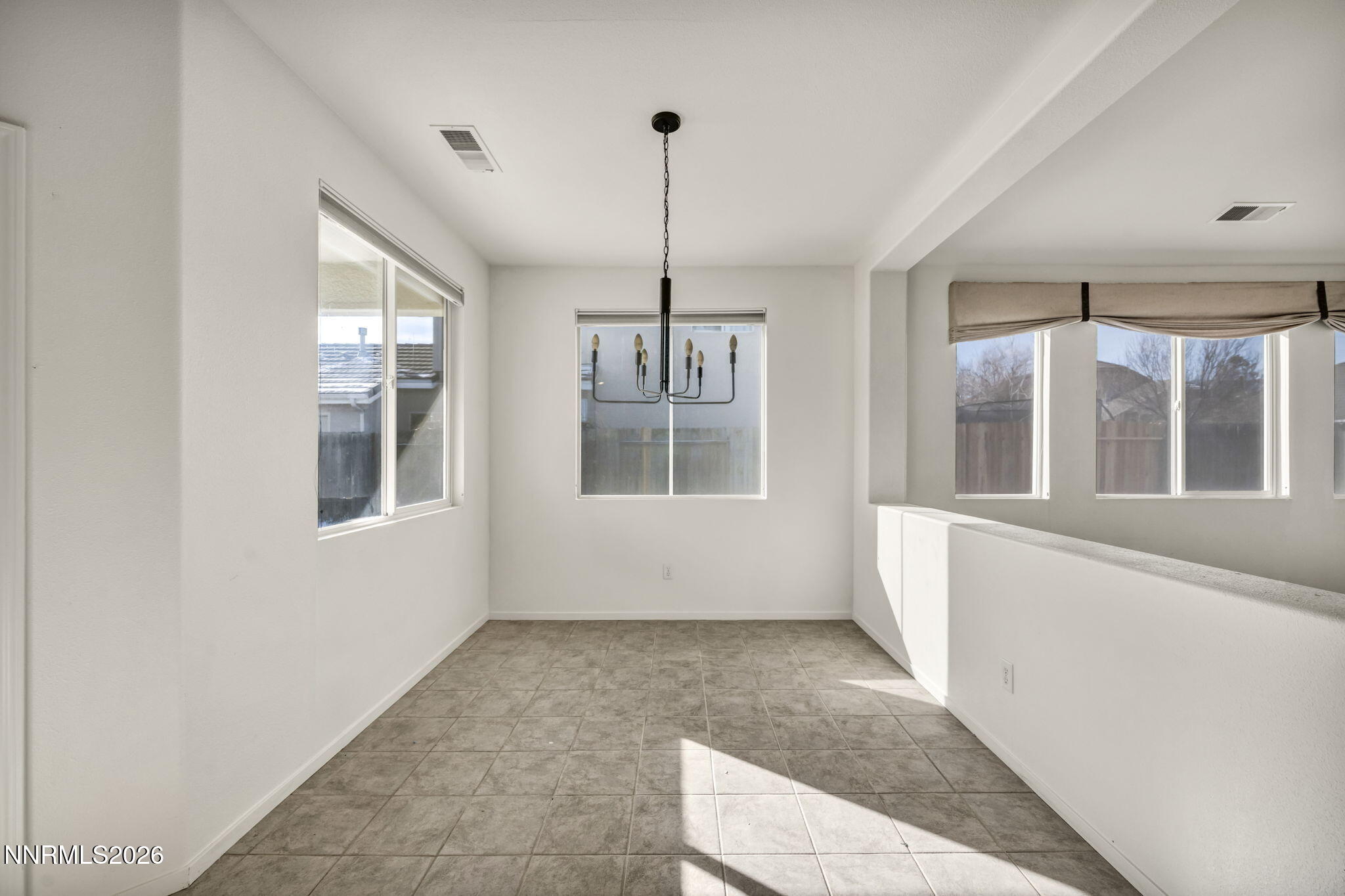 1472 Gaucho Lane Reno, NV 89521 - Photo 21 of 38 a view of an entryway with wooden floor and windows