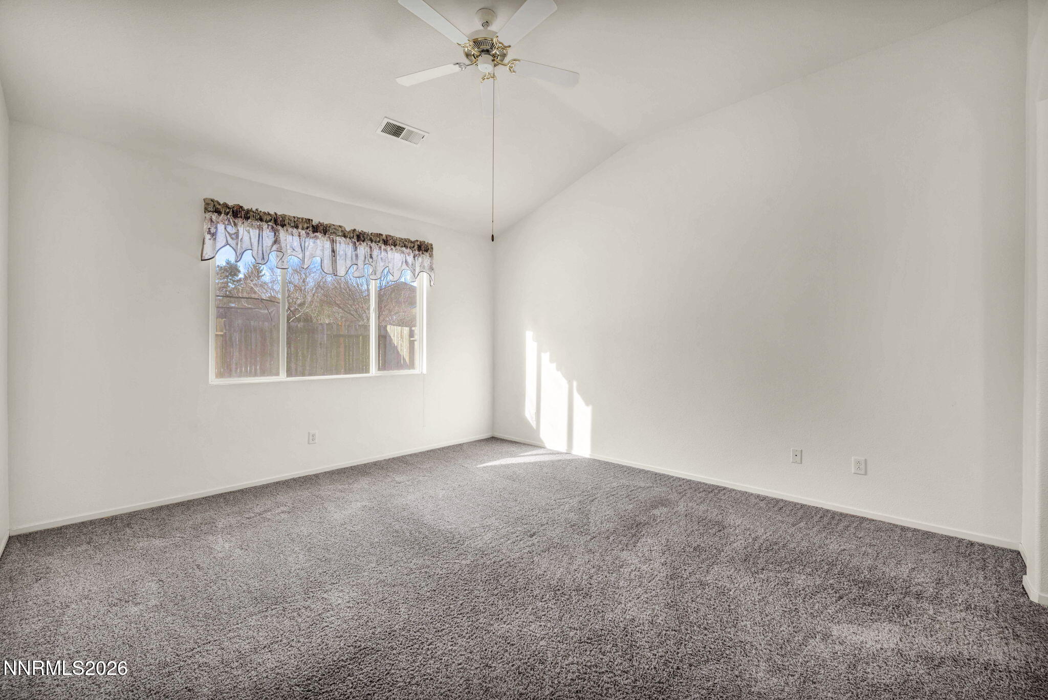1472 Gaucho Lane Reno, NV 89521 - Photo 25 of 38 an empty room with a window