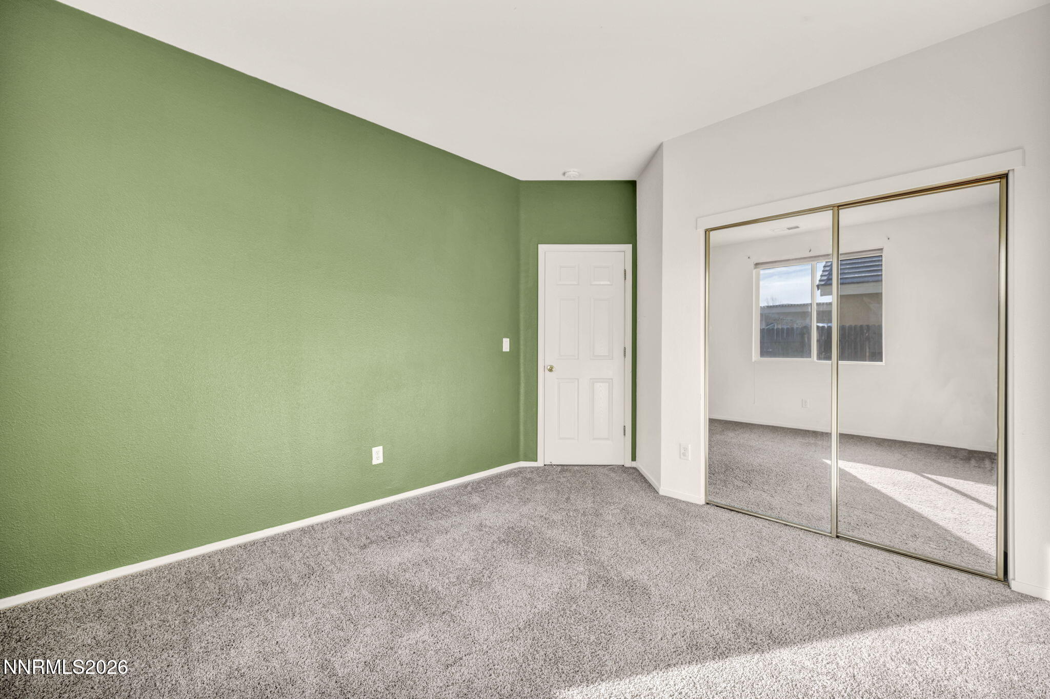 1472 Gaucho Lane Reno, NV 89521 - Photo 31 of 38 an empty room with closet and windows