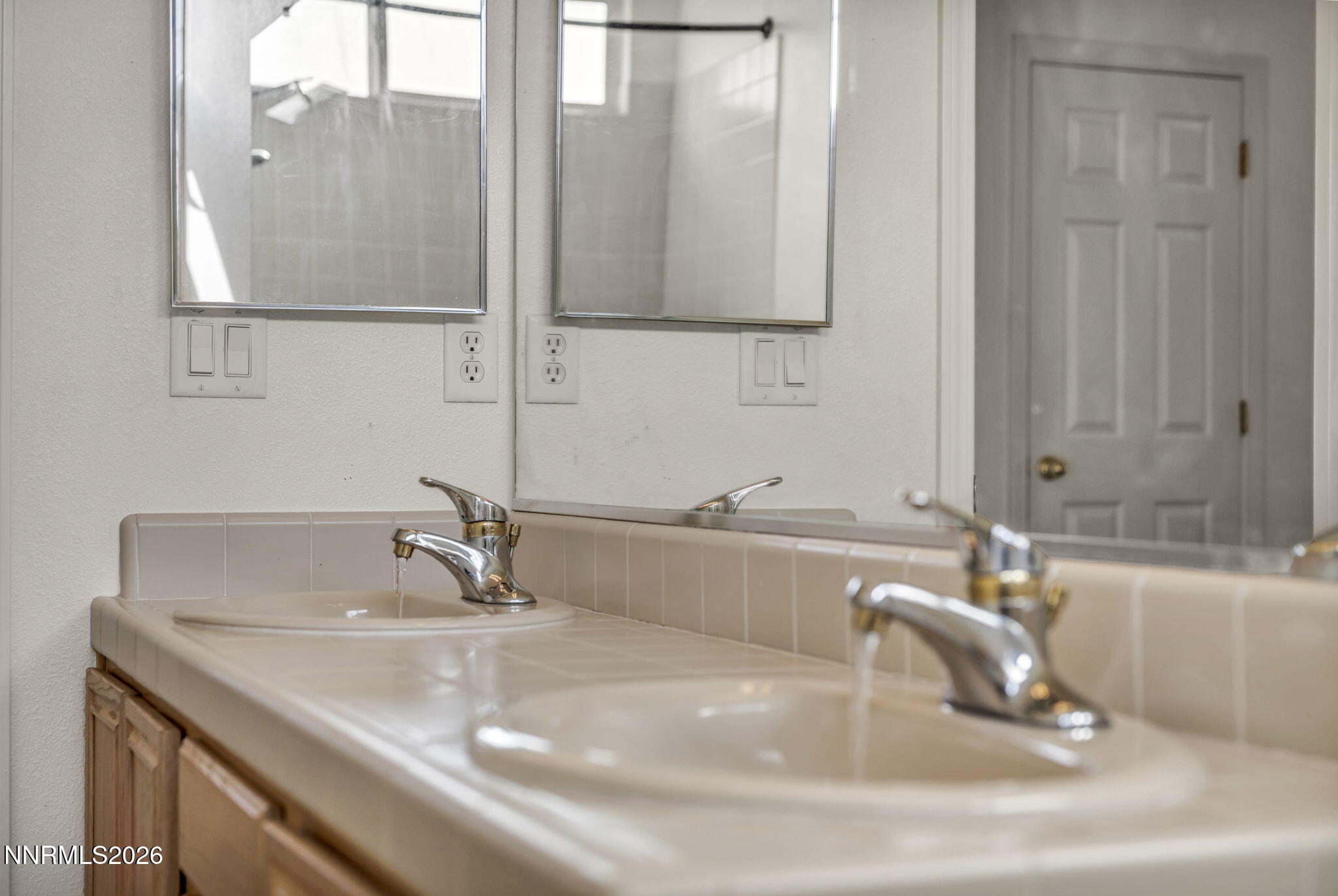 1472 Gaucho Lane Reno, NV 89521 - Photo 35 of 38 a bathroom with a sink and a mirror