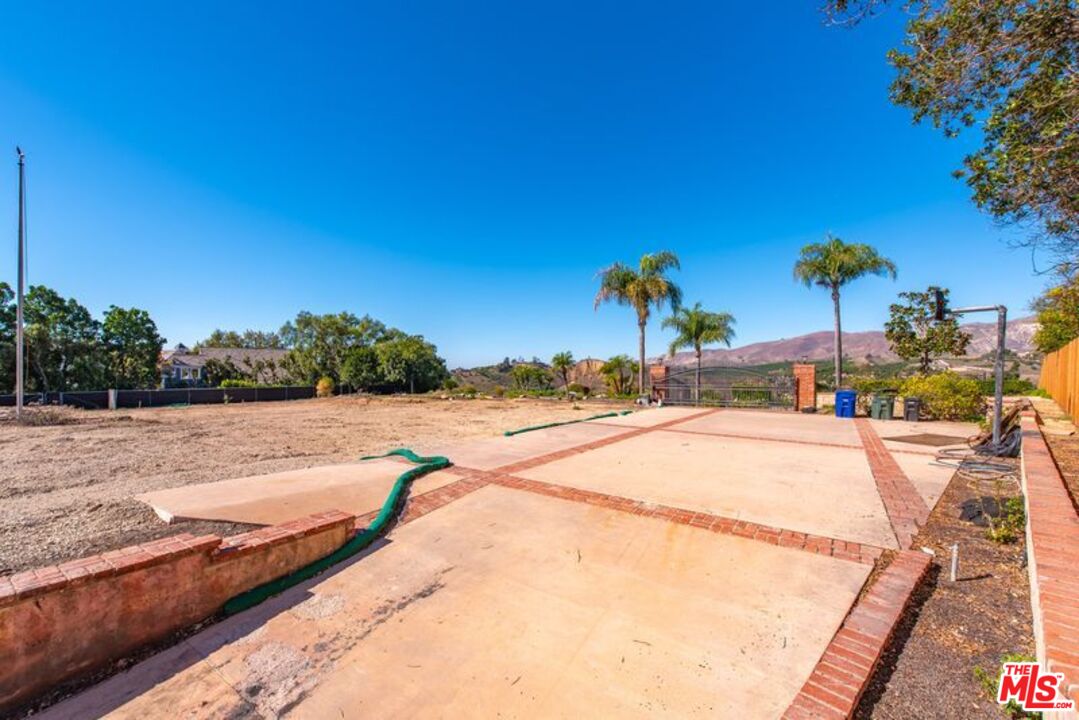 6312 Ridgecrest Lane Somis, CA 93066 - Photo 18 of 25 a view of a swimming pool with a yard