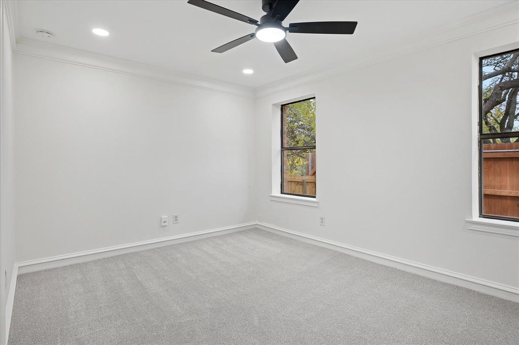 62 Legend Road Benbrook, TX 76132 - Photo 17 of 27 an empty room with windows and fan