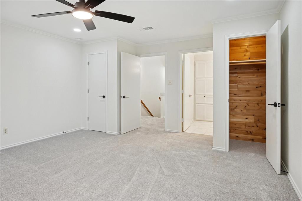 62 Legend Road Benbrook, TX 76132 - Photo 22 of 27 an empty room with closet and a ceiling fan