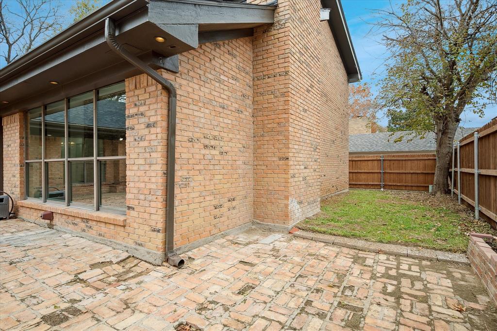 62 Legend Road Benbrook, TX 76132 - Photo 27 of 27 a backyard of a house with a yard and garage