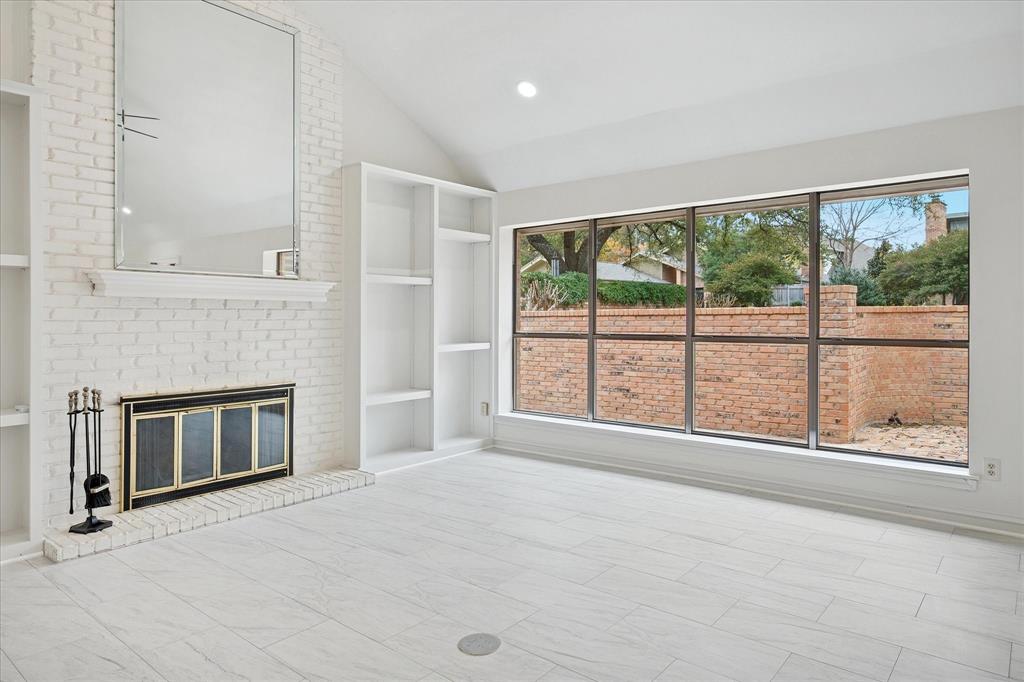 62 Legend Road Benbrook, TX 76132 - Photo 4 of 27 a view of an empty room with a fireplace and a window