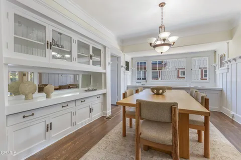 a kitchen with a refrigerator and a sink