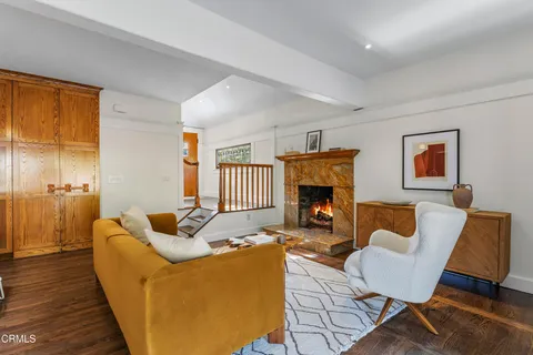 a view of a hallway with closet and a bathroom
