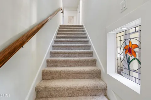 a bathroom with a bathtub and window
