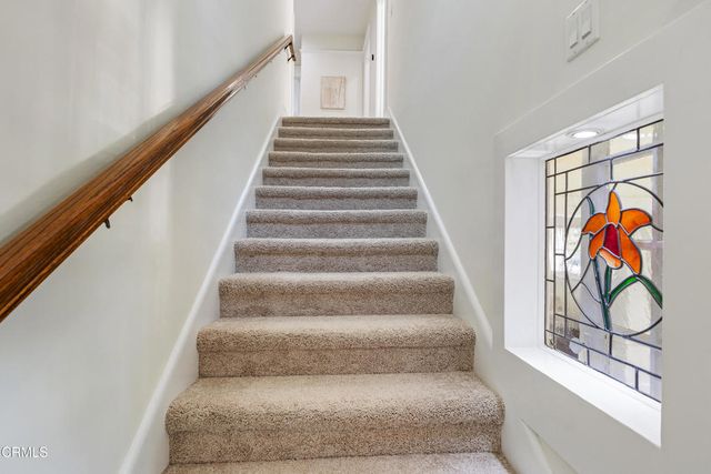 a bathroom with a bathtub and window