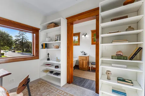 a bedroom with furniture and a ceiling fan