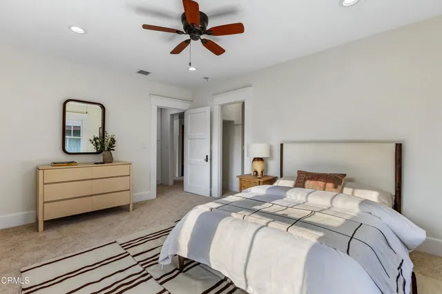 a bathroom with a granite countertop sink shower mirror and a bathtub
