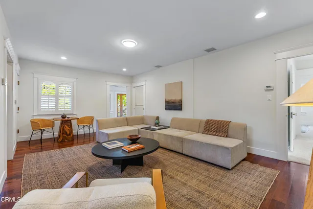 a view of a patio with a table chairs and a backyard
