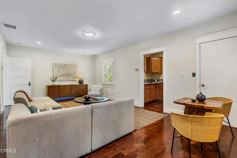 a dinning room with furniture and window