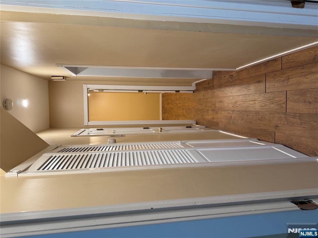 439 Cliff Street, Unit 1 Fairview, NJ 07022 - Photo 11 of 19 a view of a hallway with wooden floor