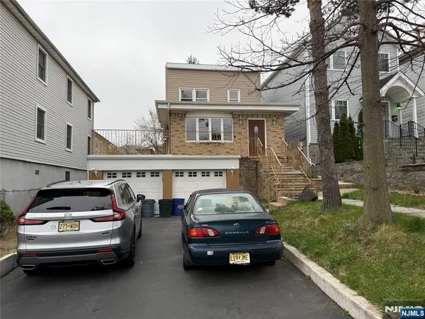 a view of residential houses with city view