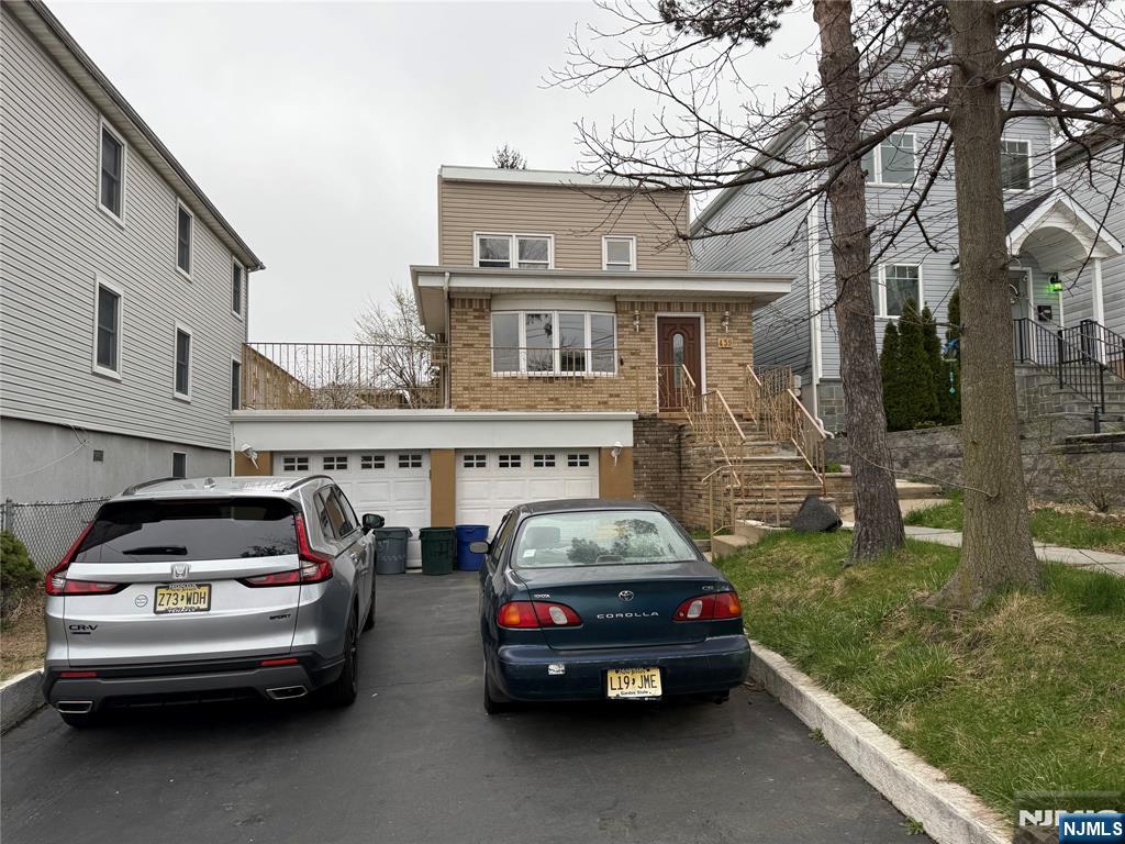 439 Cliff Street, Unit 1 Fairview, NJ 07022 - Photo 16 of 19 a car parked in front of a house