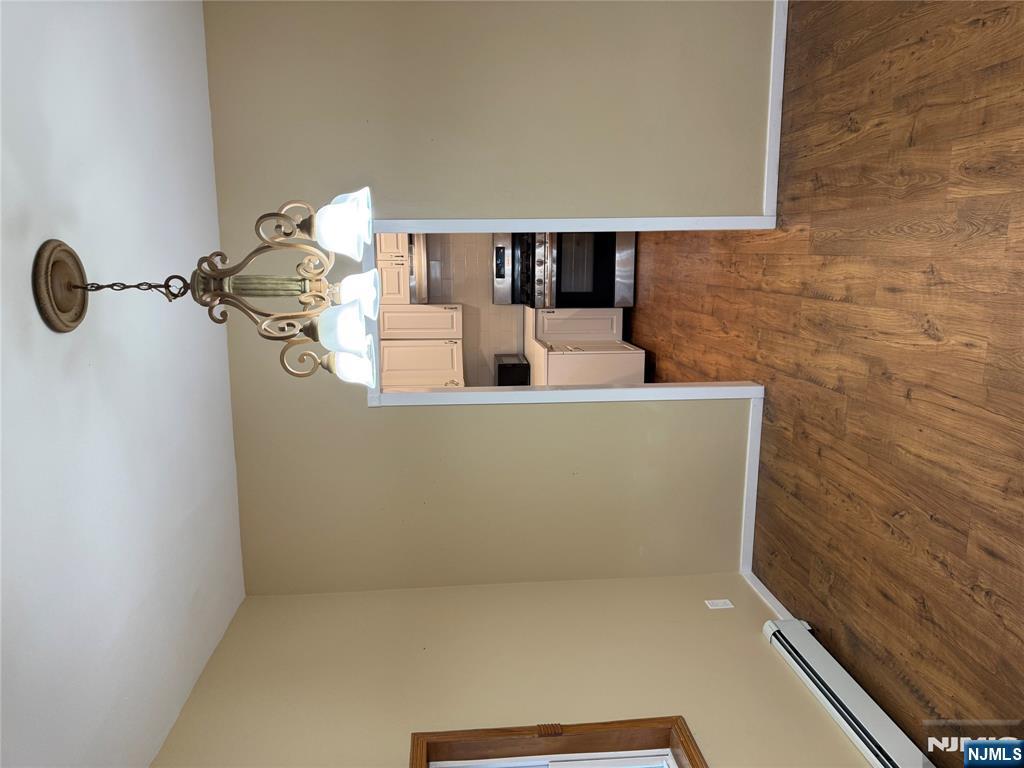 439 Cliff Street, Unit 1 Fairview, NJ 07022 - Photo 7 of 19 a view of empty room with wooden floor