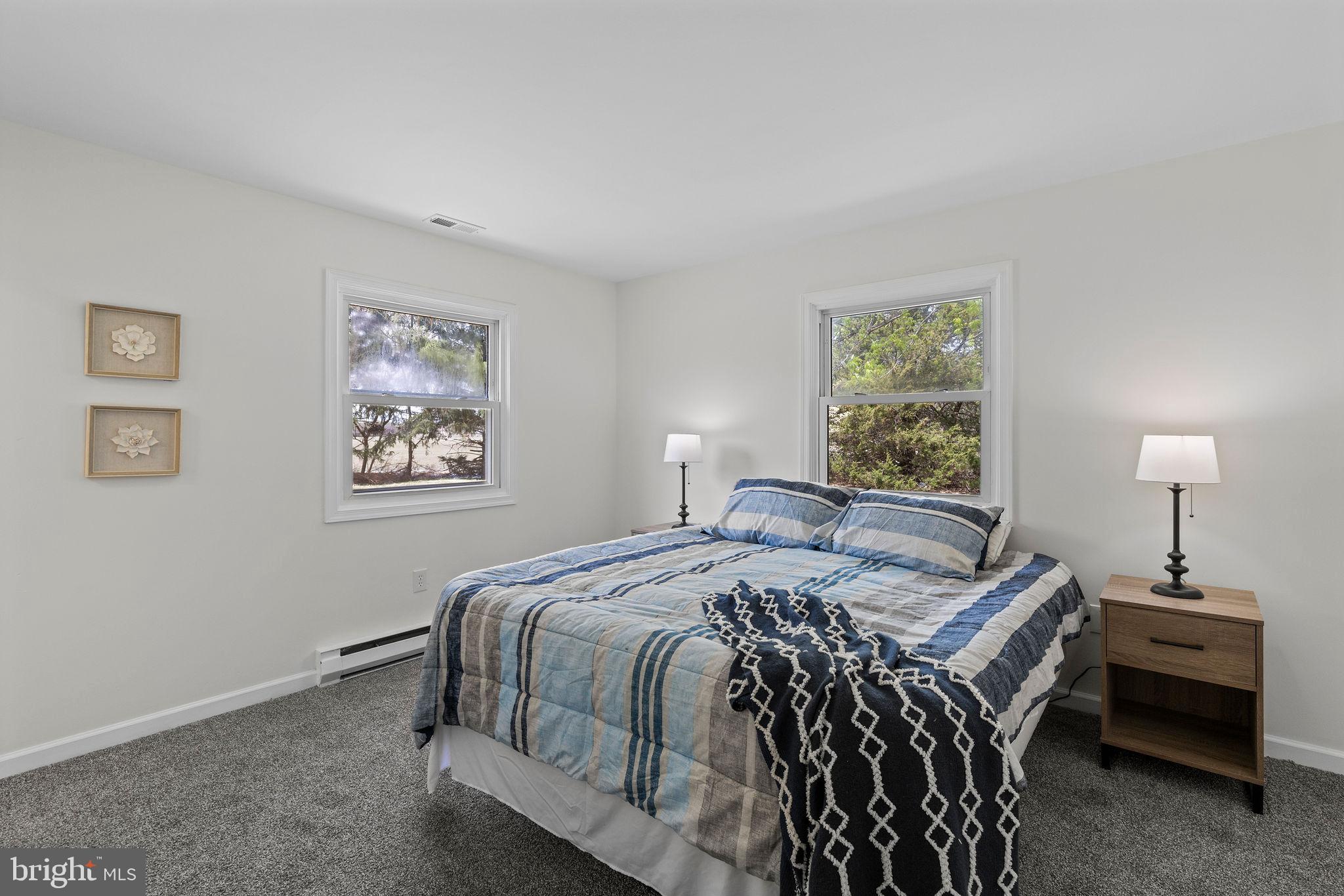 6749 Eldorado Road Federalsburg, MD 21632 - Photo 14 of 39 a bedroom with a bed and a window