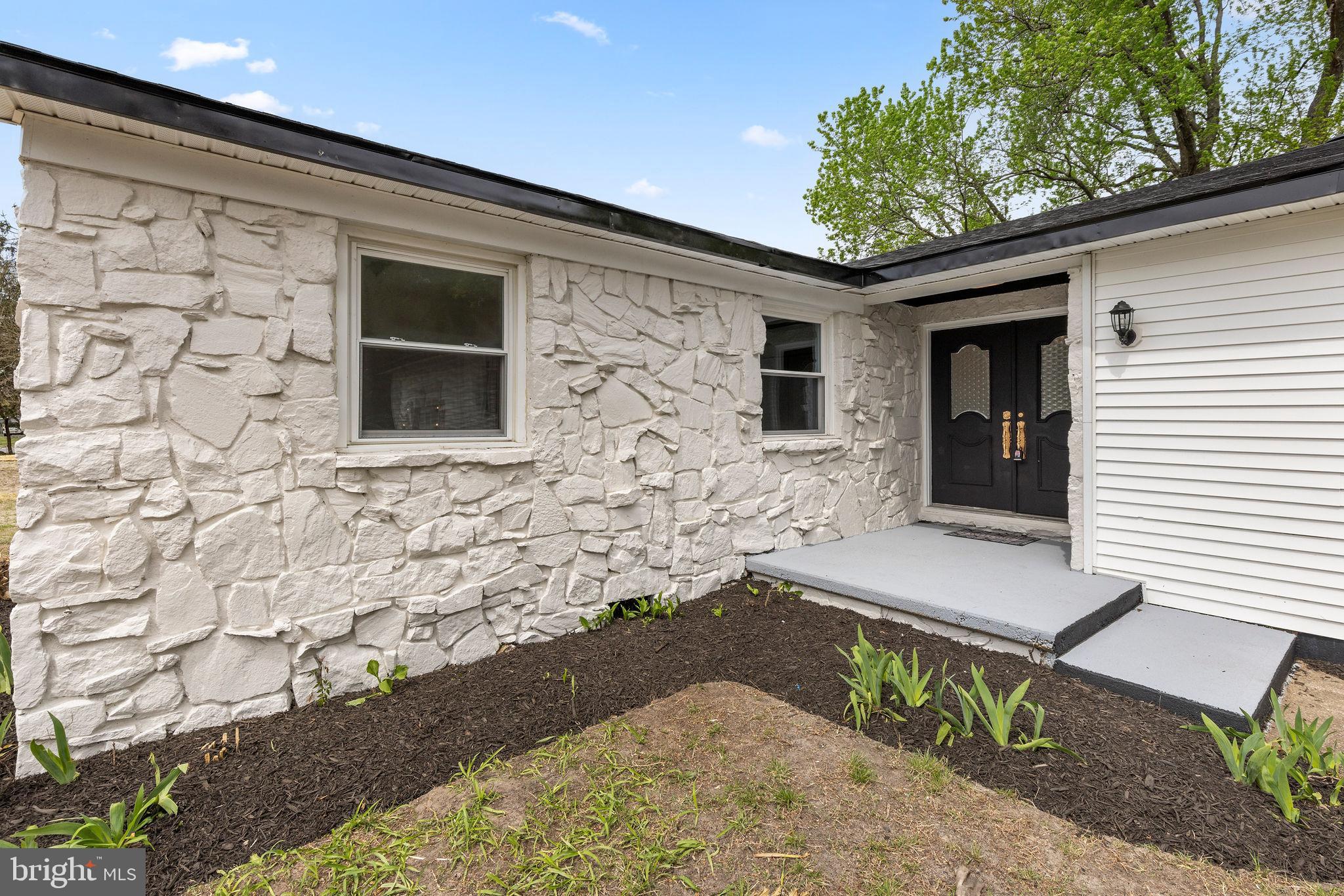 6749 Eldorado Road Federalsburg, MD 21632 - Photo 2 of 39 a front view of a house with a yard
