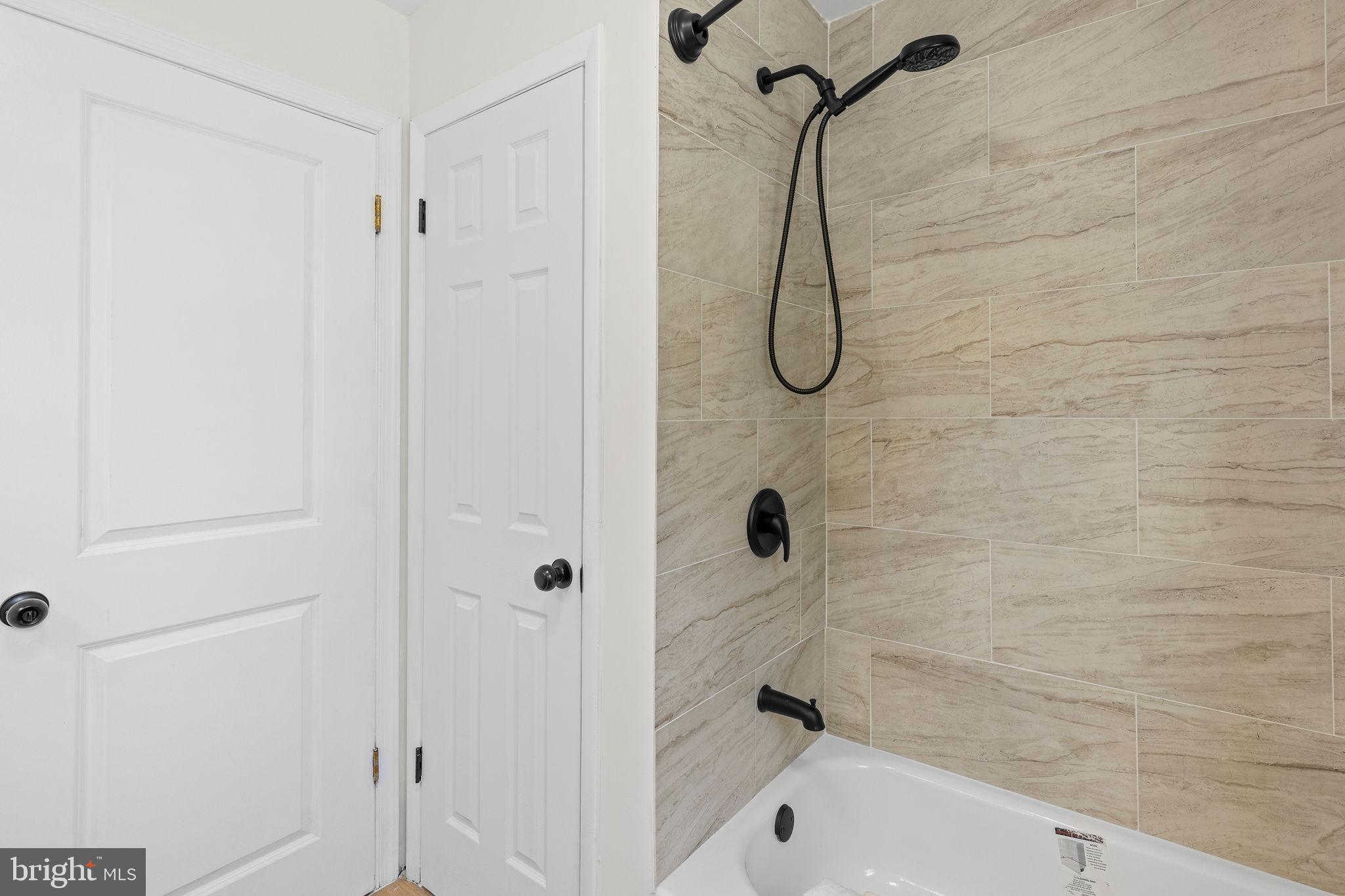 6749 Eldorado Road Federalsburg, MD 21632 - Photo 24 of 39 a bathroom with a bath tub with a shower