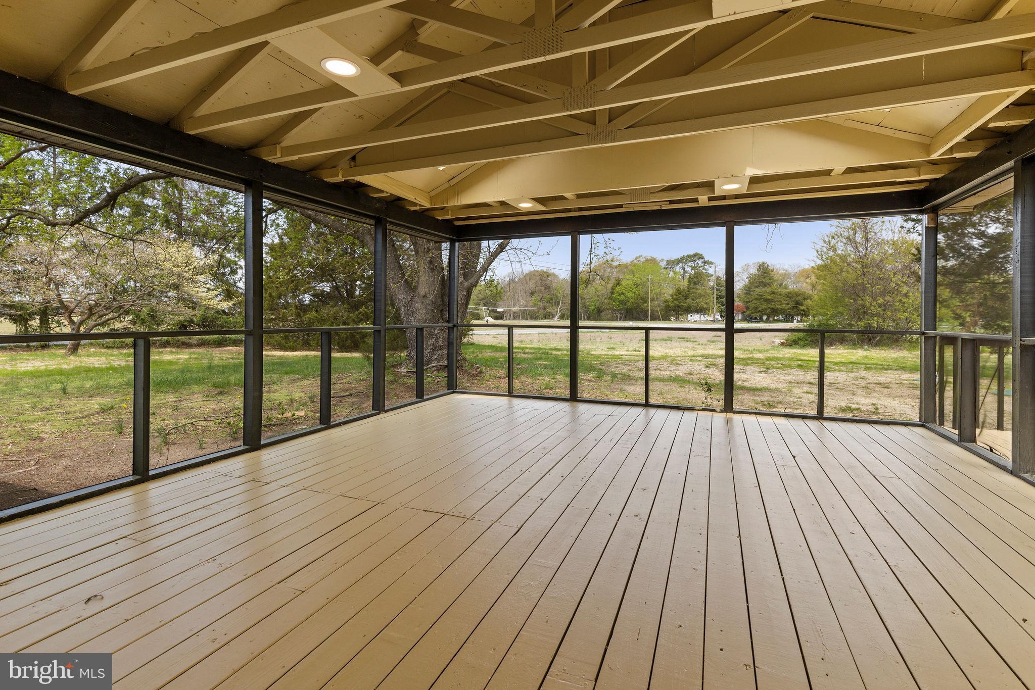 6749 Eldorado Road Federalsburg, MD 21632 - Photo 29 of 39 a view of a balcony with wooden floor