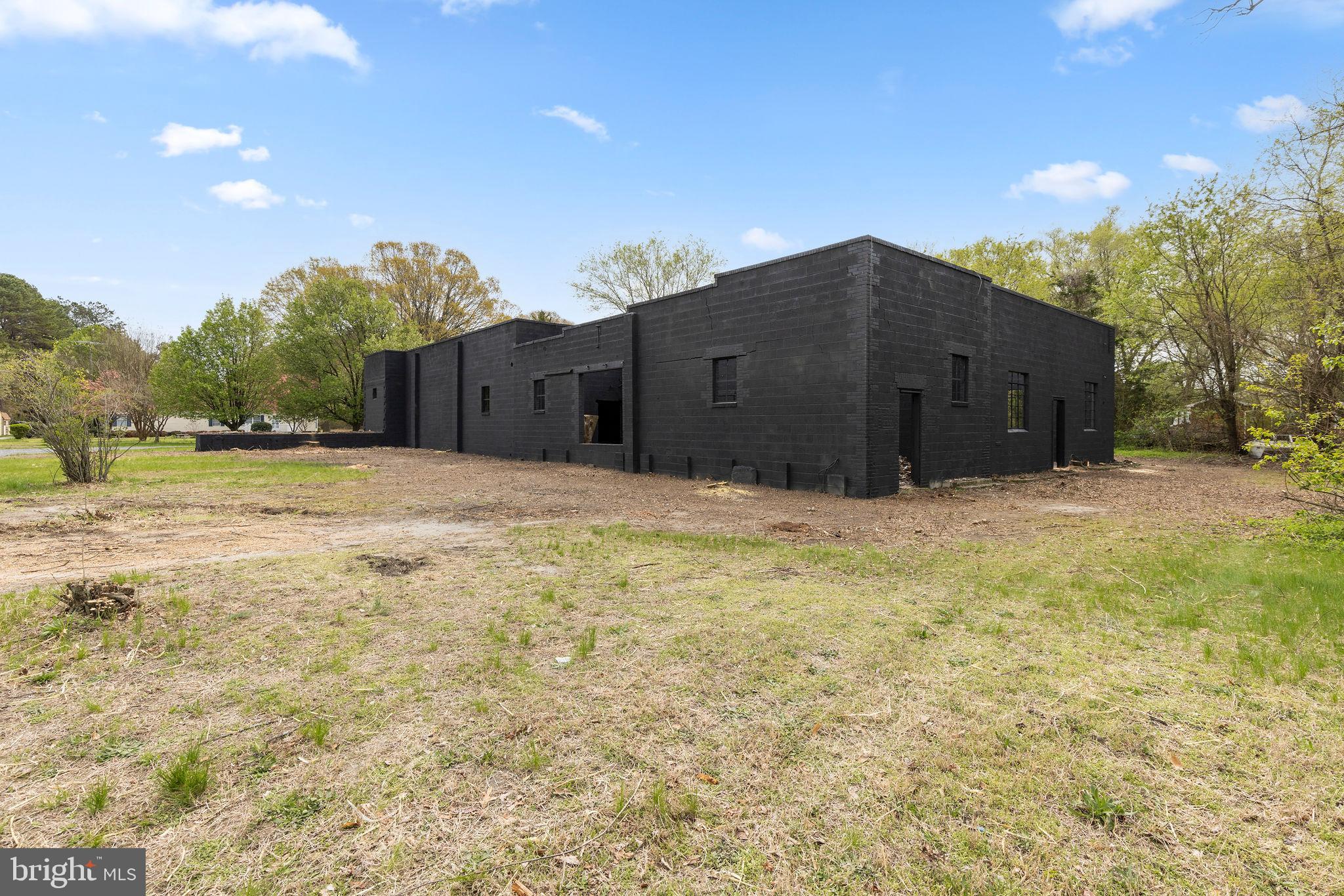 6749 Eldorado Road Federalsburg, MD 21632 - Photo 34 of 39 a view of a large house with a yard