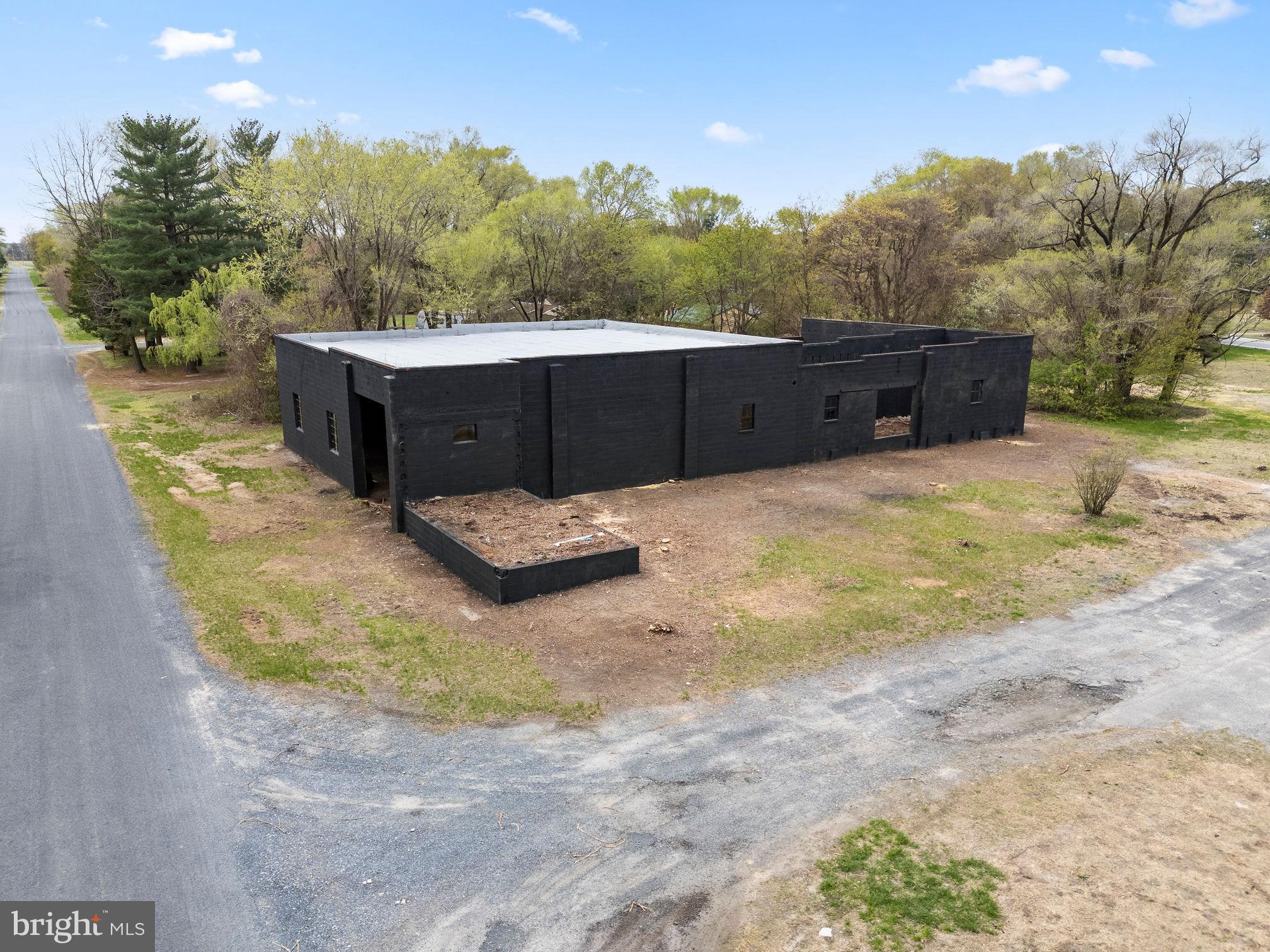6749 Eldorado Road Federalsburg, MD 21632 - Photo 35 of 39 a backyard of a house with trees and outdoor space