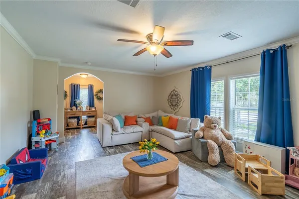 a living room with furniture and a large window
