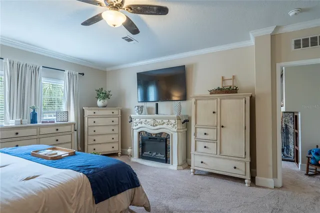 a bedroom with a bed and a fireplace